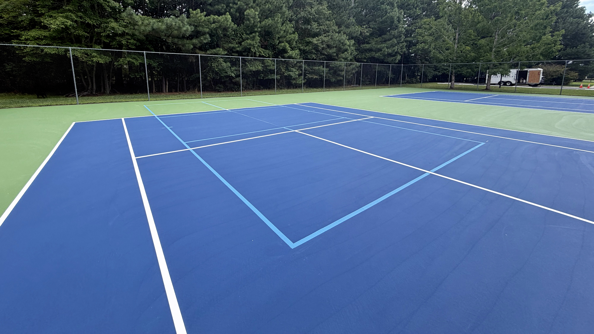 New acrylic court surface with tennis and blended pickleball lines