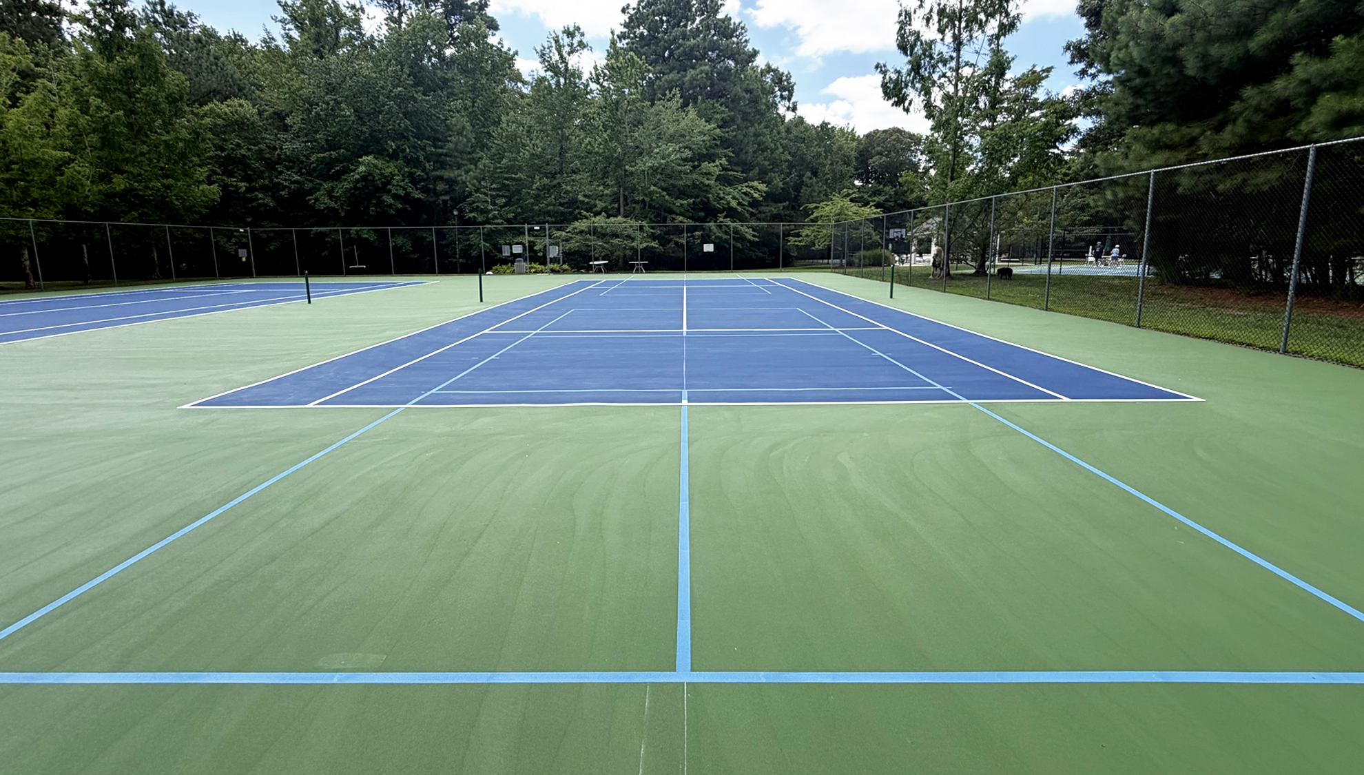 The Refuge tennis court viewed from the baseline